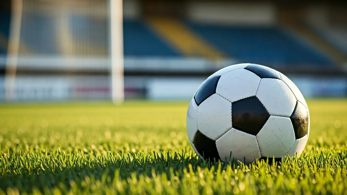 Generic image of a soccer ball on a sports field's grass.