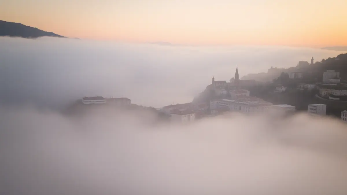 Generic image of morning fog in a Mediterranean coastal city.