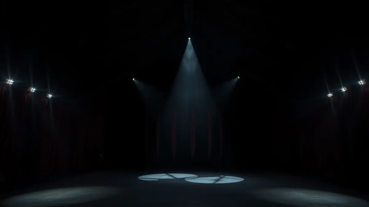 Generic image of a circus tent interior with dramatic lighting, no performers.