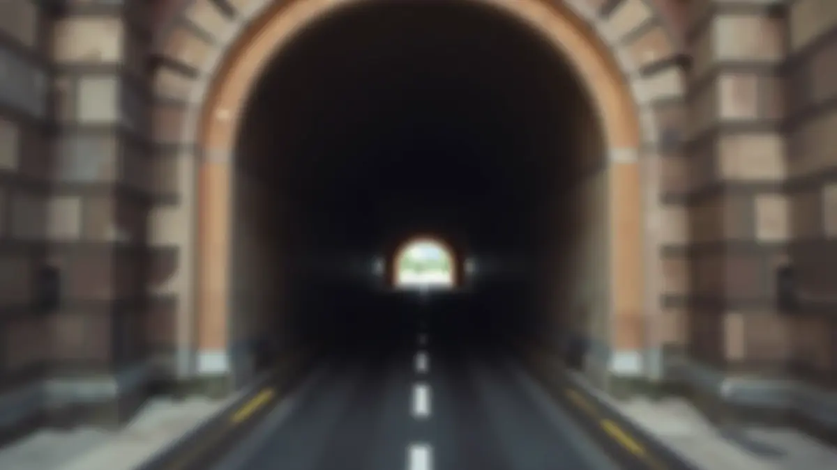 Imagen abstracta de la entrada de un túnel sin terminar, con una luz tenue al fondo, simbolizando un proyecto pendiente.