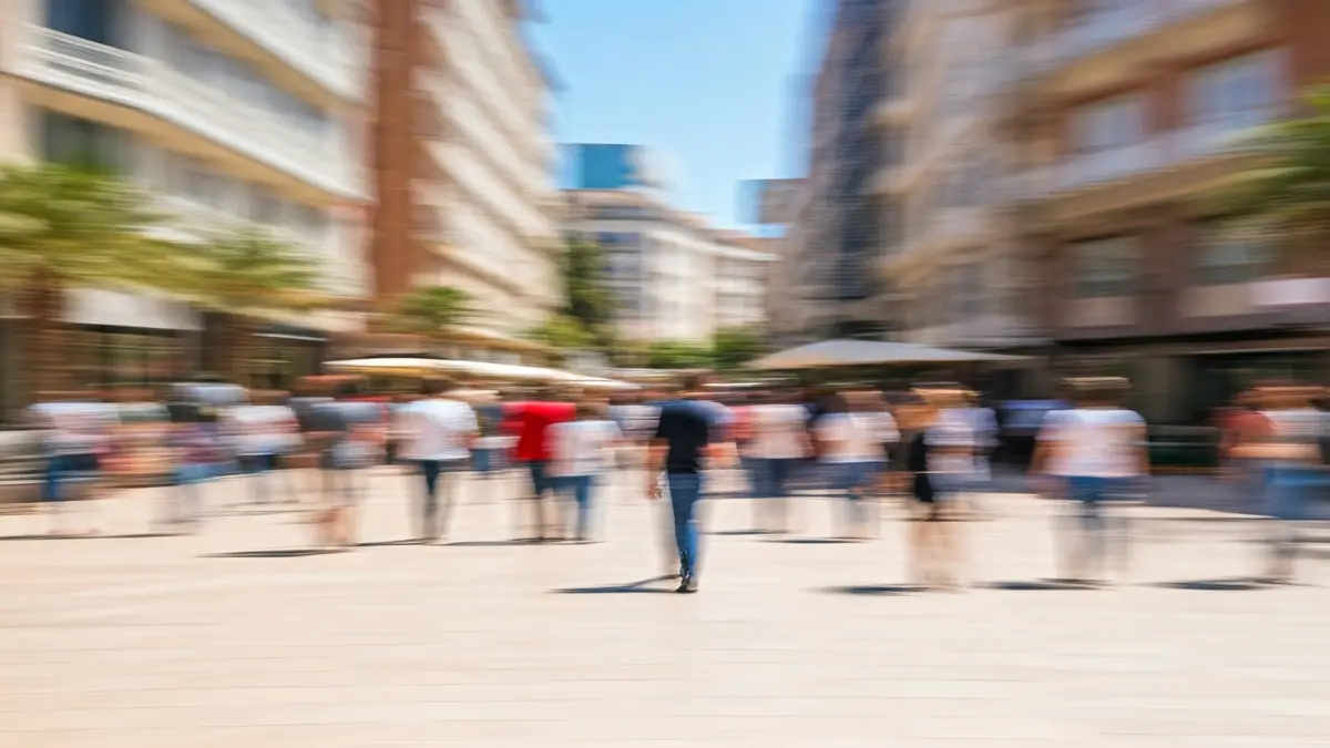 Generic image of people walking on a busy street in a Mediterranean city.