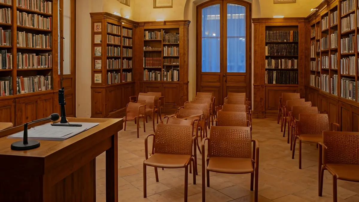 Generic image of a reading room or library with a microphone on a podium.