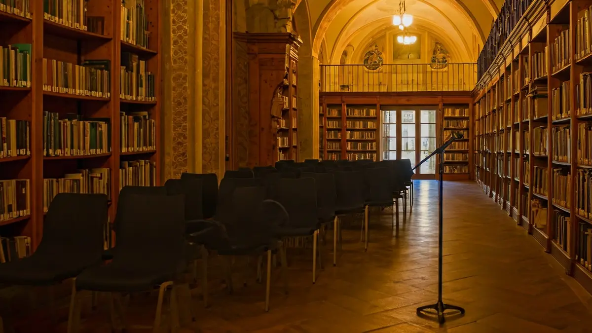 Generic image of a book presentation room with a lectern and chairs.