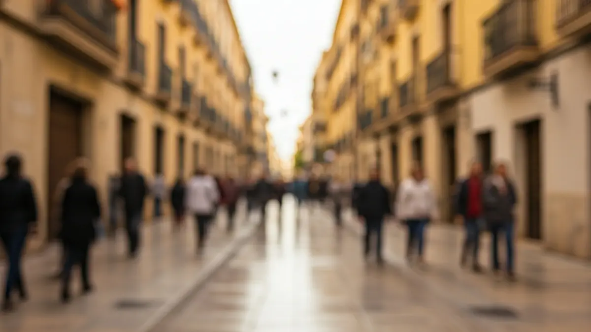 Generic image of a Valencian street with the sun breaking through clouds after rain.