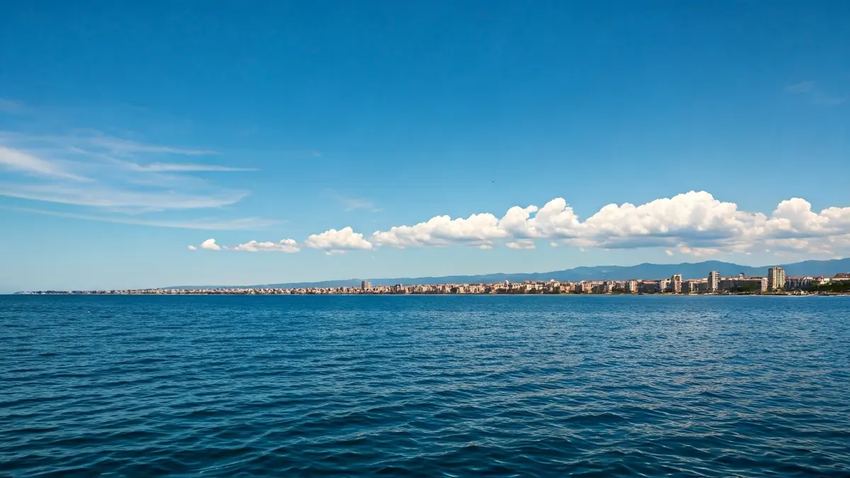Generic image of a partly cloudy sky over a Mediterranean coastal city.