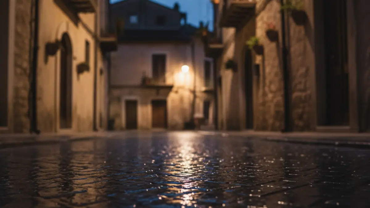 Generic image of emergency lights reflecting on wet asphalt at night, with no visible vehicles.
