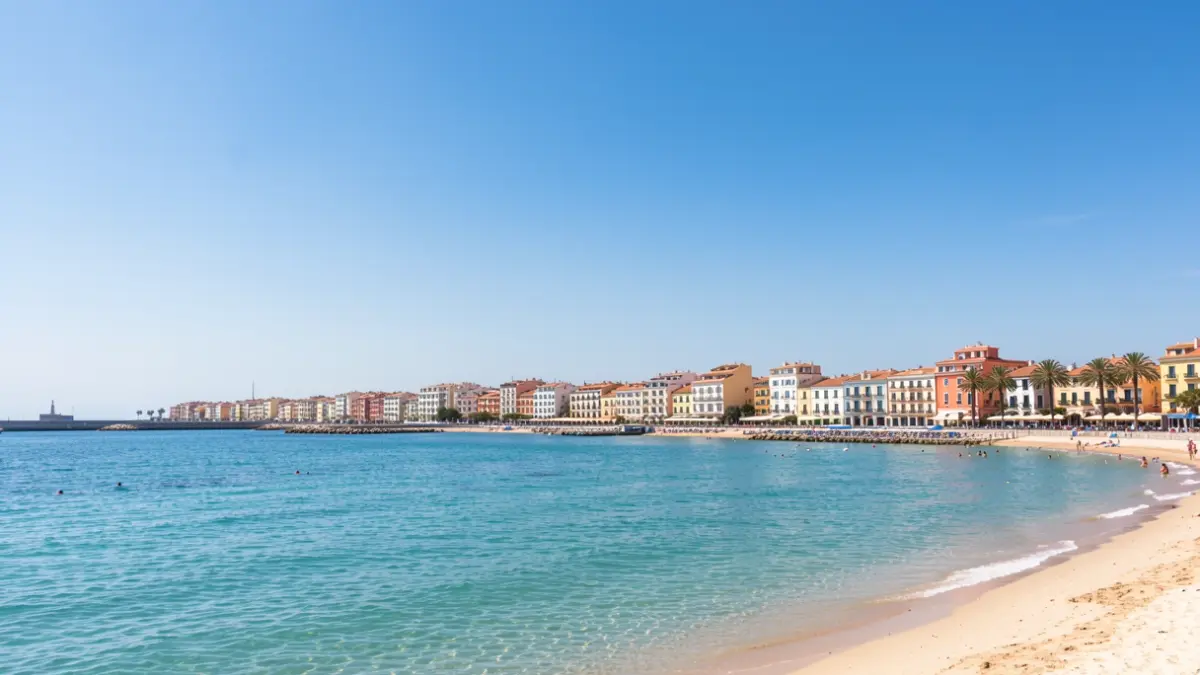 Generic image of Gandia beach with clear sky and Mediterranean architecture.