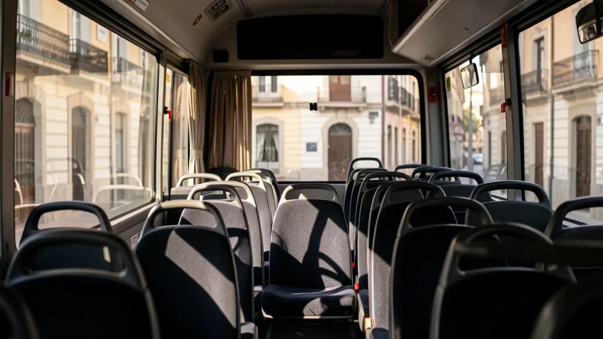 Generic image of an empty bus in Valencia with sunlight coming through the windows.