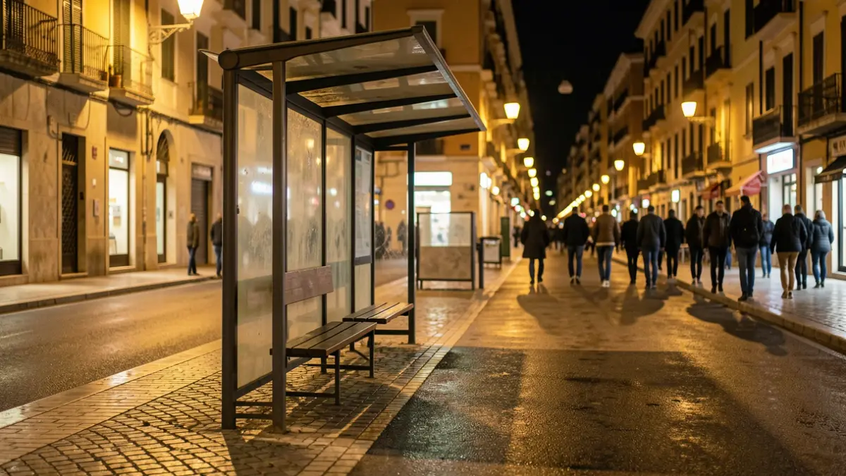 Generic image of an empty bus stop at night.